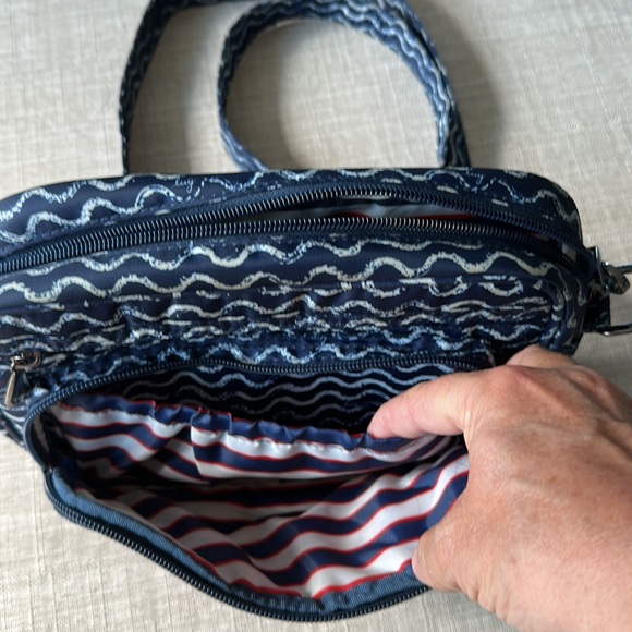 Lightly used Lug Carousel crossbody bag. Adjustable strap expands up to 26”. - Picture 2 of 6